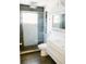 Stylish bathroom featuring a glass-enclosed shower, modern vanity and tile flooring at 2102 Applegate Dr, Ocoee, FL 34761