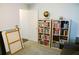 Bright bedroom with white walls, globe, and bookshelves at 2102 Applegate Dr, Ocoee, FL 34761