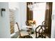 Well-lit dining room with chandelier, adjacent to stone pillar and living area at 2102 Applegate Dr, Ocoee, FL 34761
