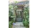Screened entry with lush plants, tile floor, and inviting welcome area at 2102 Applegate Dr, Ocoee, FL 34761