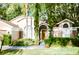 Inviting one-story home with manicured lawn, decorative plants, and covered entryway at 2102 Applegate Dr, Ocoee, FL 34761