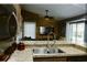 Kitchen with stainless steel sink and granite countertops at 2102 Applegate Dr, Ocoee, FL 34761