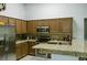 Well-lit kitchen with stainless steel appliances and granite countertops at 2102 Applegate Dr, Ocoee, FL 34761