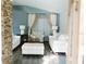Bright living room with stylish furniture, stone accent wall and hardwood flooring at 2102 Applegate Dr, Ocoee, FL 34761