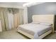 Serene main bedroom featuring plush carpeting, soothing colors and elegant lighting at 2102 Applegate Dr, Ocoee, FL 34761