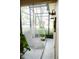 Relaxing screened patio with hanging chair, tile floor, and natural light at 2102 Applegate Dr, Ocoee, FL 34761