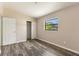 Bedroom featuring wood-look flooring, a closet, and natural light at 212 Homewood Dr, Sanford, FL 32773