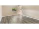 Bright living room showcasing the new gray wood floors and neutral walls, perfect for personalization and relaxation at 212 Homewood Dr, Sanford, FL 32773