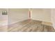 Light-filled living room boasts updated flooring and neutral tones, offering a versatile space ready for your personal touch at 212 Homewood Dr, Sanford, FL 32773