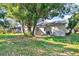 Spacious backyard featuring mature trees and ample green space at 2417 Cedar Ave, Sanford, FL 32771