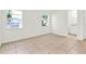 This bedroom includes tile flooring and two windows to let in natural light at 2417 Cedar Ave, Sanford, FL 32771