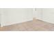 Neutral bedroom featuring tile flooring, white walls, and natural light at 2417 Cedar Ave, Sanford, FL 32771