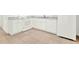 Bright kitchen with white appliances, modern countertops, and tile flooring at 2417 Cedar Ave, Sanford, FL 32771