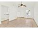 Open living area featuring tile floors, ample natural light, and flows into the kitchen at 2417 Cedar Ave, Sanford, FL 32771