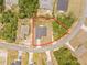 Aerial view of a property showcasing its boundaries, neighboring houses, and surrounding trees at 2506 Sw 158Th Lane Rd, Ocala, FL 34473