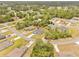 Aerial view of home on a street in the community surrounded by trees and neighboring homes at 2506 Sw 158Th Lane Rd, Ocala, FL 34473