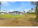 Expansive backyard featuring a well-maintained lawn and ample space for outdoor activities at 2506 Sw 158Th Lane Rd, Ocala, FL 34473