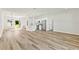 Modern living space featuring wood-look floors, an island, and stainless steel appliances at 2506 Sw 158Th Lane Rd, Ocala, FL 34473