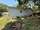 Exterior view of home with lawn and mature trees at 25824 Shawnee St, Sorrento, FL 32776