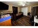 Bedroom with wood-look floors, ceiling fan, and closet at 25824 Shawnee St, Sorrento, FL 32776