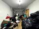 View of a garage packed with storage bags and miscellaneous storage items at 25824 Shawnee St, Sorrento, FL 32776