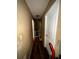 Hallway with neutral walls and wood flooring at 25824 Shawnee St, Sorrento, FL 32776