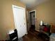 Hallway showing a closet, doorways, and wood-look floors at 25824 Shawnee St, Sorrento, FL 32776