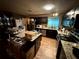 Eat-in kitchen featuring stainless steel appliances and granite countertops at 25824 Shawnee St, Sorrento, FL 32776