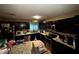 Well-equipped kitchen with ample counter space, appliances, and wood cabinets at 25824 Shawnee St, Sorrento, FL 32776