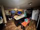 View of the living room open to the kitchen, plus wood floors and natural light at 25824 Shawnee St, Sorrento, FL 32776