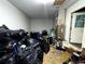 View of a storage room packed with bags, storage, and equipment at 25824 Shawnee St, Sorrento, FL 32776