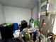 View of a storage room packed with equipment, supplies, and storage at 25824 Shawnee St, Sorrento, FL 32776