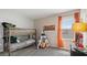 A bedroom featuring a bunk bed, window with orange drapes, and decorative teepee for fun at 2871 Haze Rd, Clermont, FL 34714