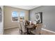 Comfortable dining room with a wood table, seating for six, and two windows for natural light at 2871 Haze Rd, Clermont, FL 34714