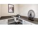 Office with built-in desk space, white cabinets, and a modern decorative display on the corner at 2871 Haze Rd, Clermont, FL 34714