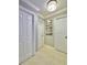 Bright hallway with neutral paint, tiled floor, and classic trim at 3130 S Bumby Ave # S, Orlando, FL 32806