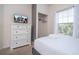 Well-lit bedroom featuring a comfortable bed, closet, dresser and neutral colors creating a relaxing and inviting space at 3229 Cupid Pl, Kissimmee, FL 34747