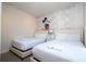 Themed bedroom featuring two beds, whimsical decor and soft, neutral colors creating a playful and inviting space at 3229 Cupid Pl, Kissimmee, FL 34747