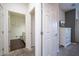 Hallway with a view into a bathroom and bedroom, offering easy access and a convenient layout at 3229 Cupid Pl, Kissimmee, FL 34747