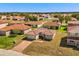 Aerial view of a single-story home with a red tile roof at 441 Caraway Dr, Kissimmee, FL 34759