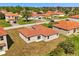 Aerial view of a single-story home with a red tile roof at 441 Caraway Dr, Kissimmee, FL 34759
