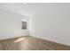 Bright bedroom with wood-look floors and a window at 441 Caraway Dr, Kissimmee, FL 34759