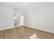 Bright bedroom with wood-look floors and a doorway at 441 Caraway Dr, Kissimmee, FL 34759
