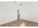 Bright bedroom with wood-look floors and a doorway at 441 Caraway Dr, Kissimmee, FL 34759