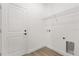 Convenient laundry room with white door and shelving at 441 Caraway Dr, Kissimmee, FL 34759