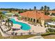 A beautiful pool with palm trees at 441 Caraway Dr, Kissimmee, FL 34759
