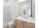 Bathroom features a single vanity, tile floors, and a walk-in shower at 453 Sorrento Rd, Kissimmee, FL 34759