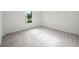 Bright bedroom with neutral carpet and window that provides natural light at 453 Sorrento Rd, Kissimmee, FL 34759