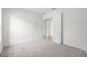 The bedroom has carpeted floors, and a double-door closet for storage at 453 Sorrento Rd, Kissimmee, FL 34759