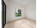 Dining room featuring tile floors, a chandelier, backyard views, and sliding glass door access at 453 Sorrento Rd, Kissimmee, FL 34759